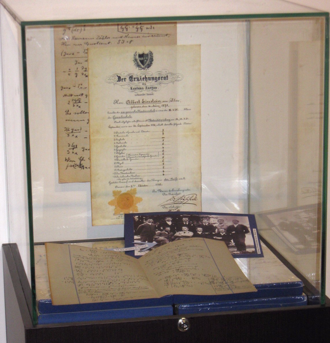 Display case filled with reproductions of material from the Archives holdings